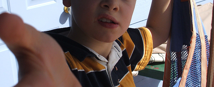 boy reaching out his hand