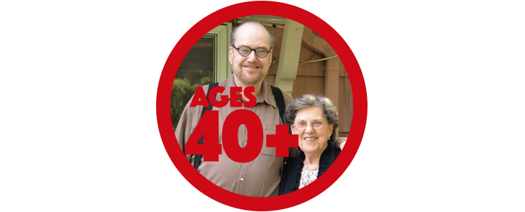 Adult son and senior mother on back porch of their home, smiling.