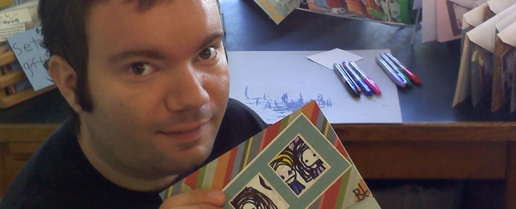 Ben holding up one of his hand crafted cards.