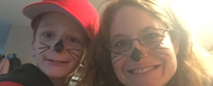 Mother and son dressed for halloween as cats