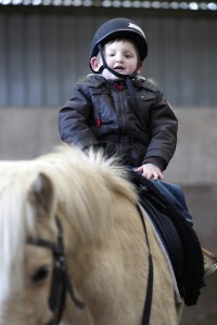 Boy with a disability riding a horse