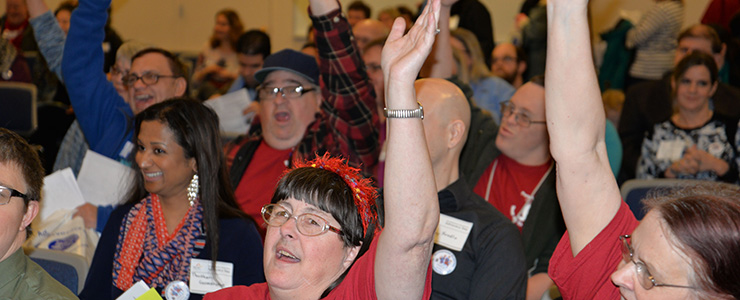 crowd at advocacy day with raised hands in cheer