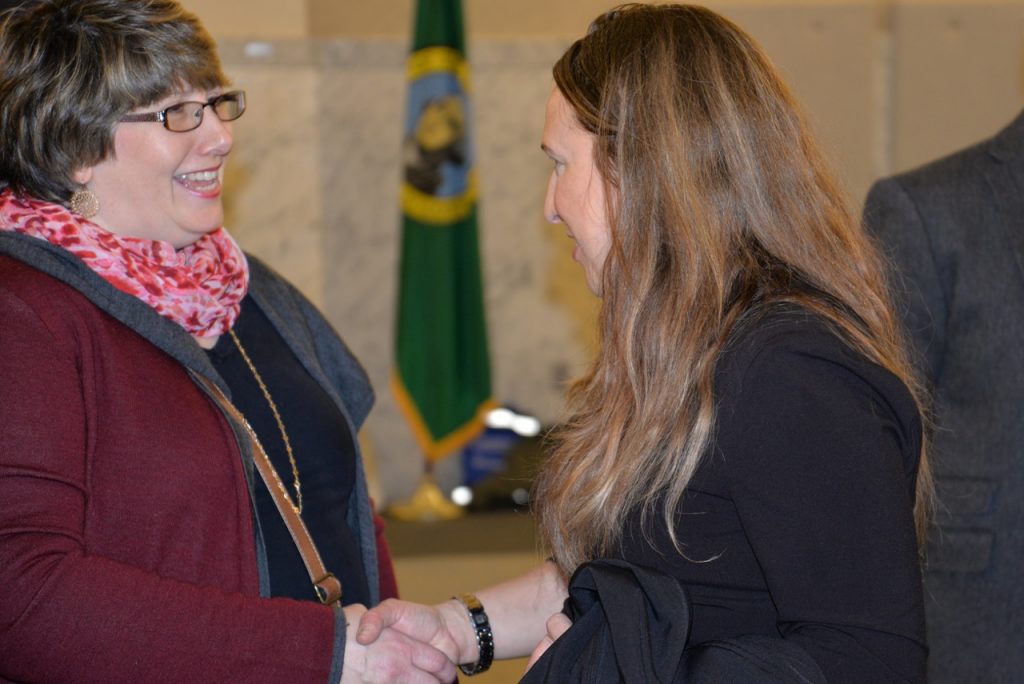 DD Council member shaking hands at a legislative reception.