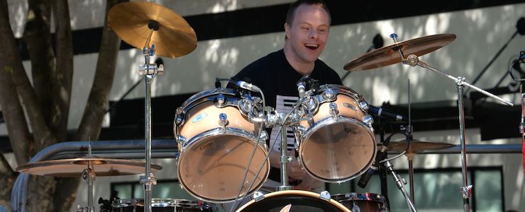Drummer with Down syndrome at a public event.
