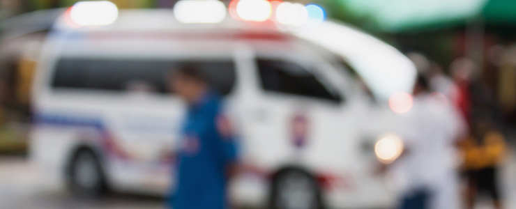 Ambulance responding to an emergency call blurred background