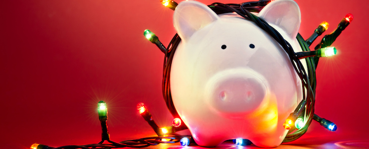 Piggy bank wrapped in Christmas string lights