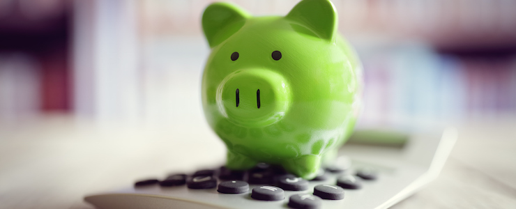 Piggy bank on calculator concept for saving, accounting, banking and business account