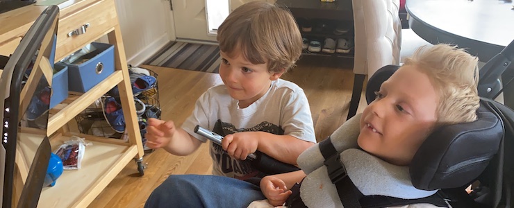 Jack and Charlie at home, watching a video screen..